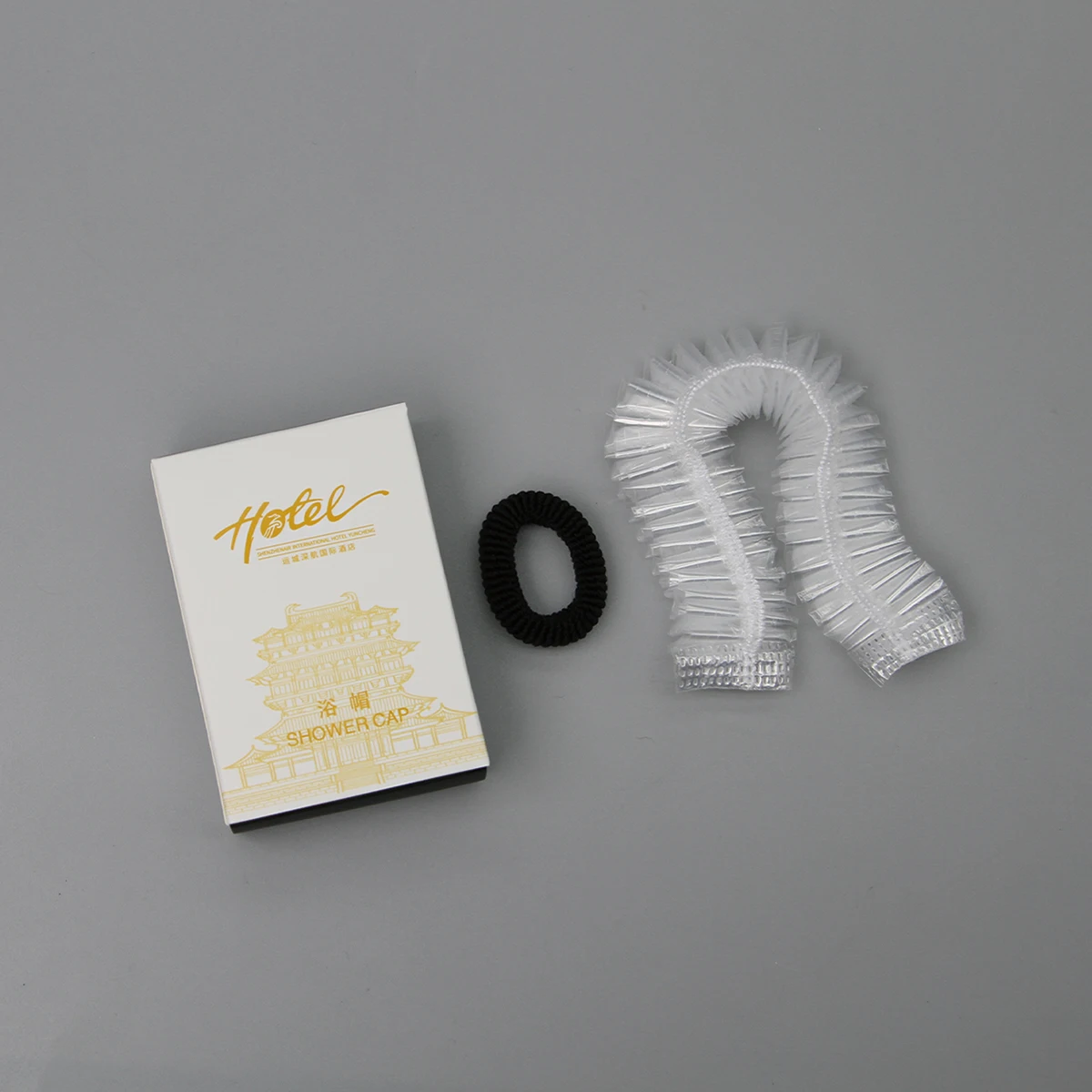 Gorro de ducha desechable personalizado de plástico PE impermeable para adultos, para salón y spa de hotel, cuidado del cabello: directo de fábrica