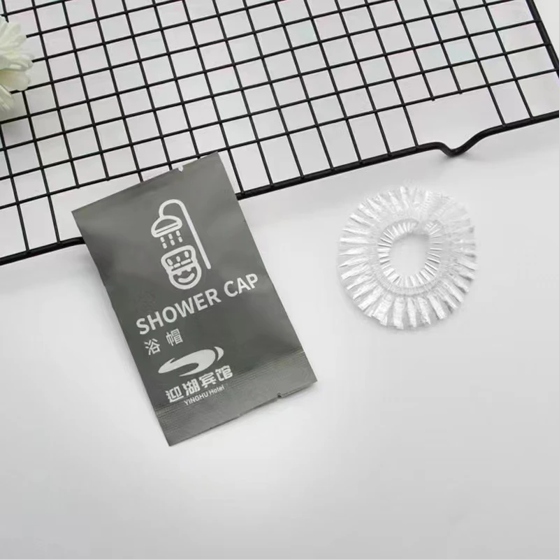 Gorro de ducha desechable personalizado de plástico PE impermeable para adultos, para salón y spa de hotel, cuidado del cabello: directo de fábrica